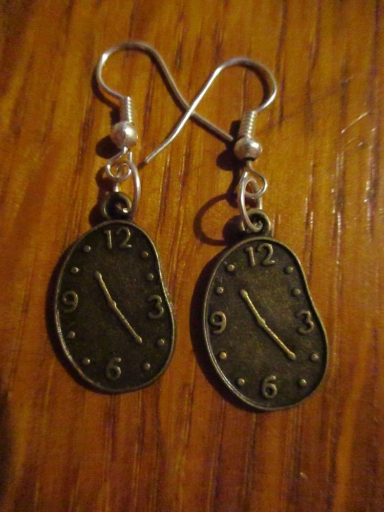 Brass tone Melted Clockface Styled Earrings