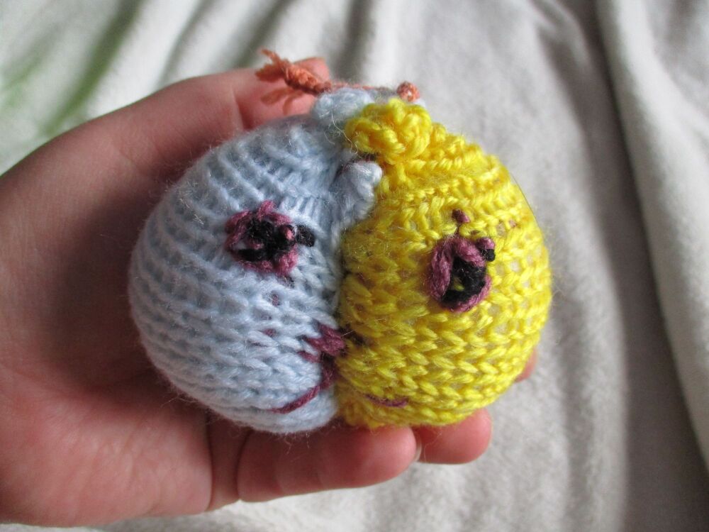 Pale Blue & Yellow Poppop Ball - Orange Roots - Purple Black Features - Knitted Soft Toy