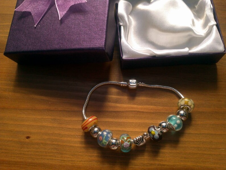 Stunning Summer Peacock charm bracelet. Snake Chain with snap closure. Gift boxed.