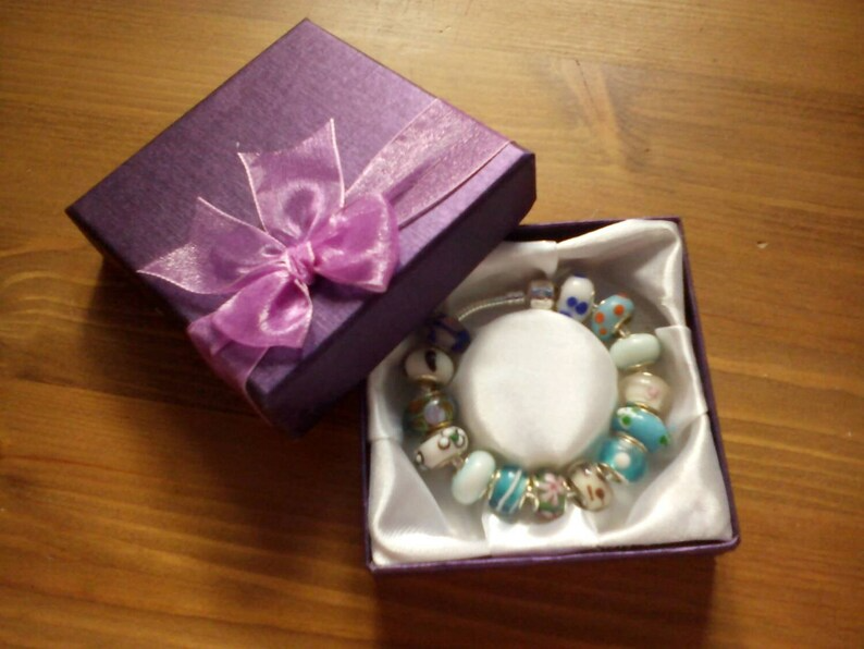 Stunning Seaside Summer charm bracelet. Snake Chain with snap closure. Gift boxed.
