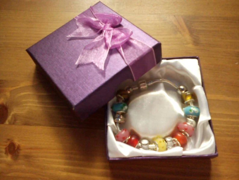 Stunning floral summer cats and pigs charm bracelet. Snake Chain with snap closure. Gift boxed.