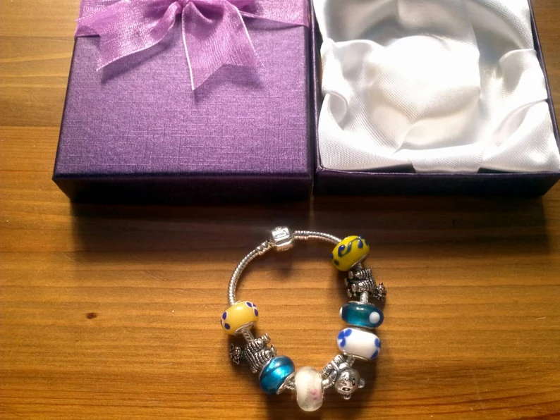 Stunning Summer Bear and Lambs charm bracelet. Snake Chain with snap closure. Gift boxed.