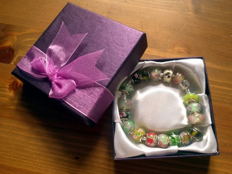 Stunning Earthy Hedgerow Florals Summer charm bracelet. Snake Chain with snap closure. Gift boxed.