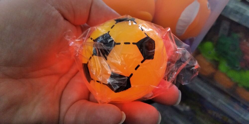 Yellow light up small football with colourful LED ball inside - Hoot