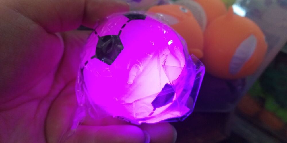 Pink light up small football with colourful LED ball inside - Hoot