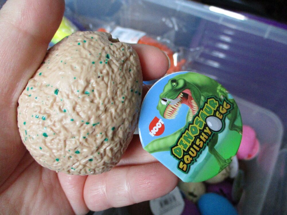 Light Brown Squishy Dinosaur Egg - Liquid Filled with baby Raptor Dino inside - Hoot