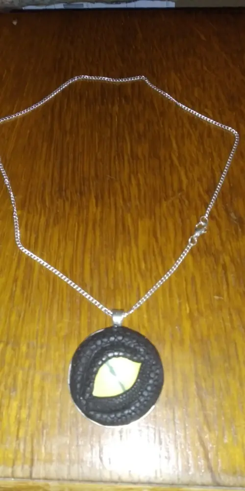 Yellow Pupil - Black Clay Crafted Dragon Eye Pendant with chain