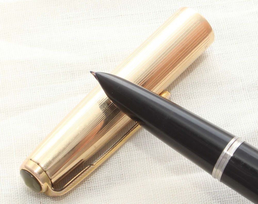 8647 Parker 51 Aerometric in Black with a Rolled Gold Cap. Smooth Fine Nib.