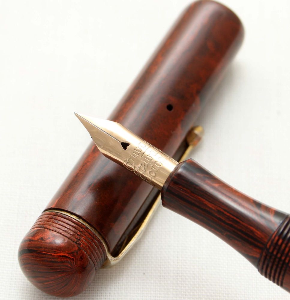 9570. Superb Early Conway Stewart Pen in Mottled Red Hard Rubber. Extra Fin