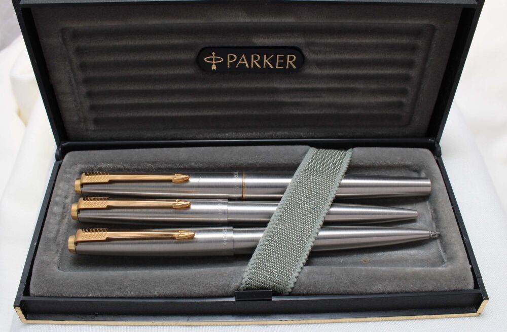 4699 Parker 45 Flighter Triple Set in Brushed Steel with Gold trim. Mint and Boxed. Fine Nib.