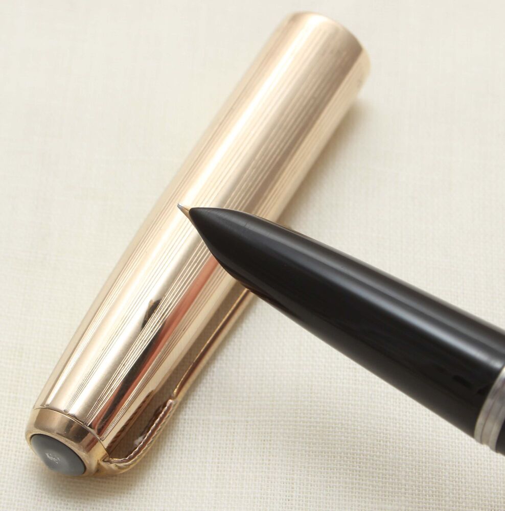 5069 Parker 51 Aerometric in Black with a Rolled Gold Cap. Smooth Fine Nib.