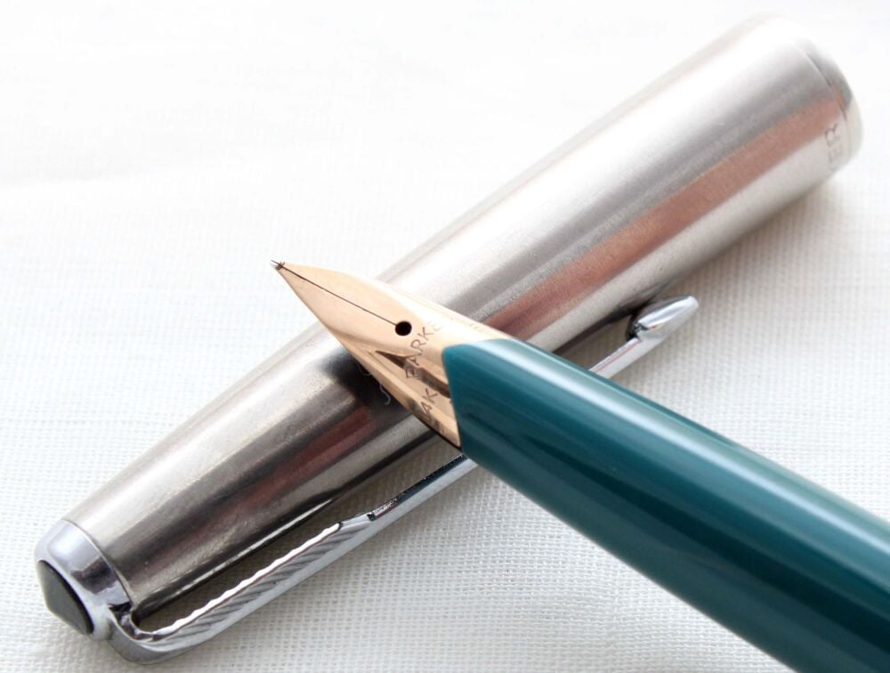5302 Parker 65 in Teal Blue with a Lustraloy Cap. Fine Nib. Mint and Boxed.