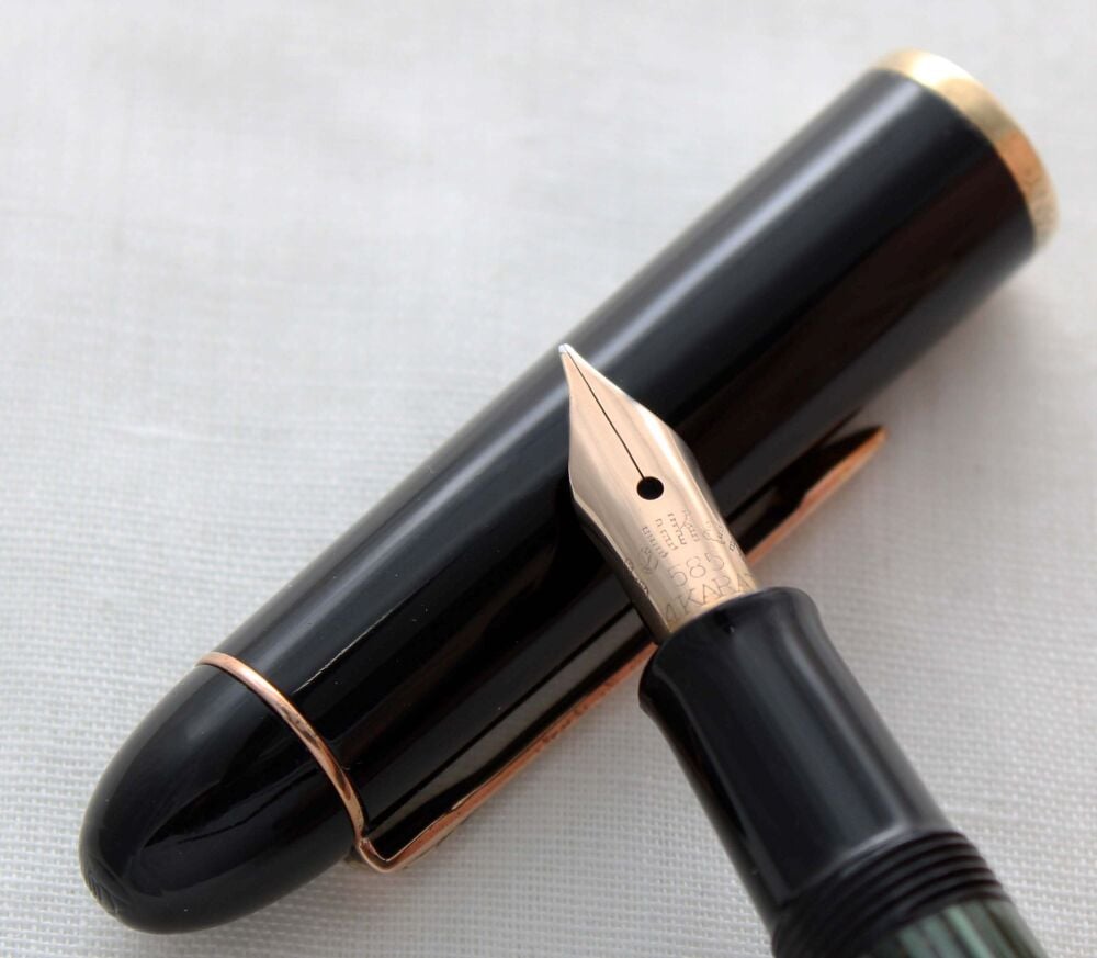 5169 Pelikan 140 Fountain Pen in Striped Green Celluloid with a Black cap and turning button. Fabulous Fine FIVE STAR nib.