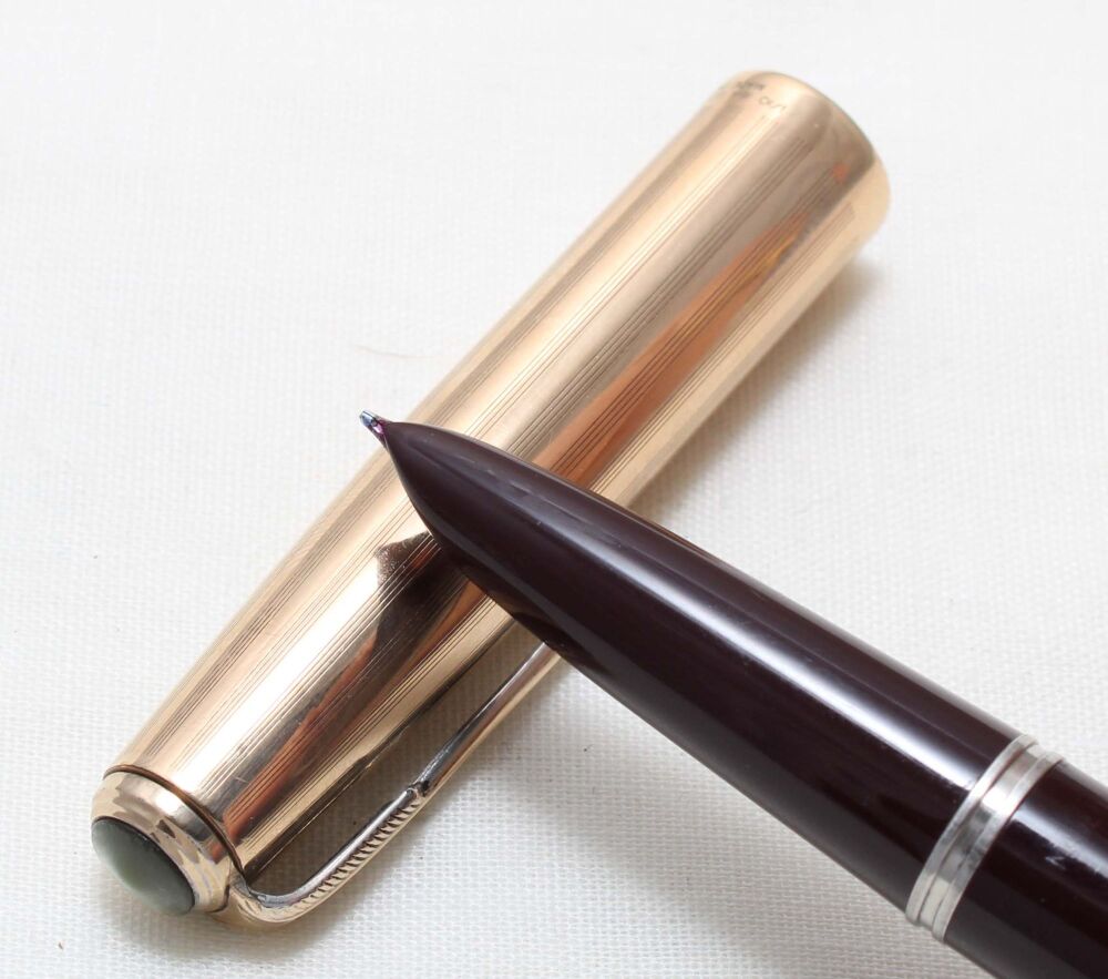 5473 Parker 51 Aerometric in Burgundy with a Rolled Gold Cap. Fine side of Medium FIVE STAR Nib.