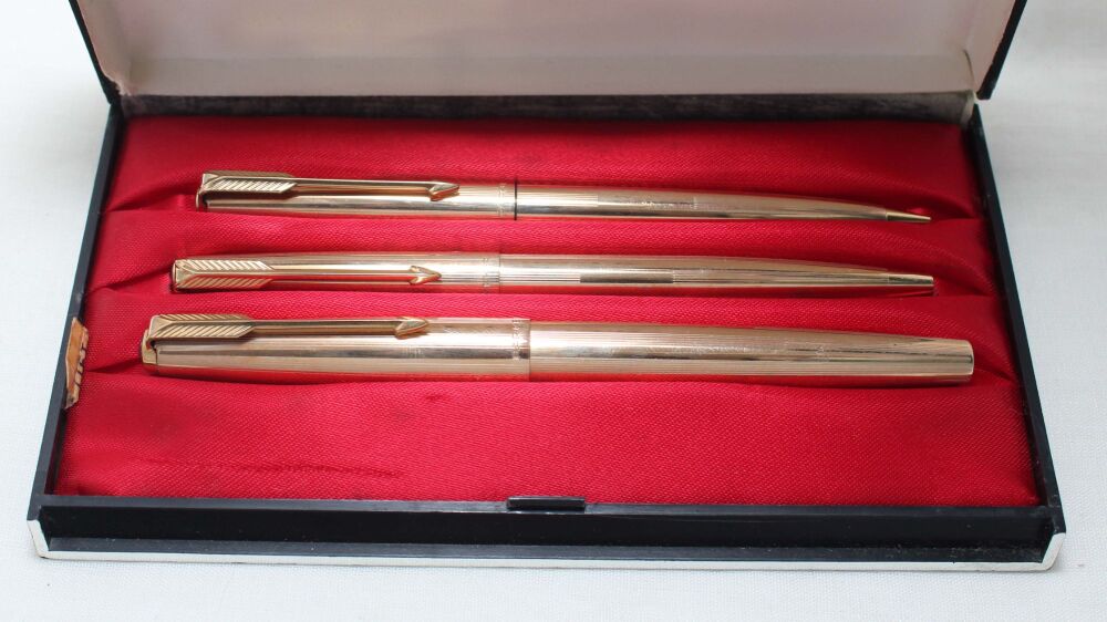 5564 Parker 61 Custom Insignia Triple Set in Rolled Gold, Medium Nib, Mint and Boxed.