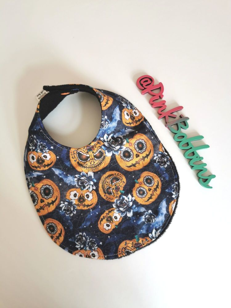 Spooky pumpkin faces rounded bib - in stock 
