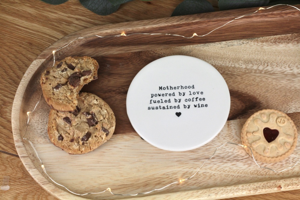 Motherhood fuelled by coffee and sustained by wine Ceramic Coaster