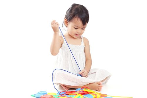 little girl threading