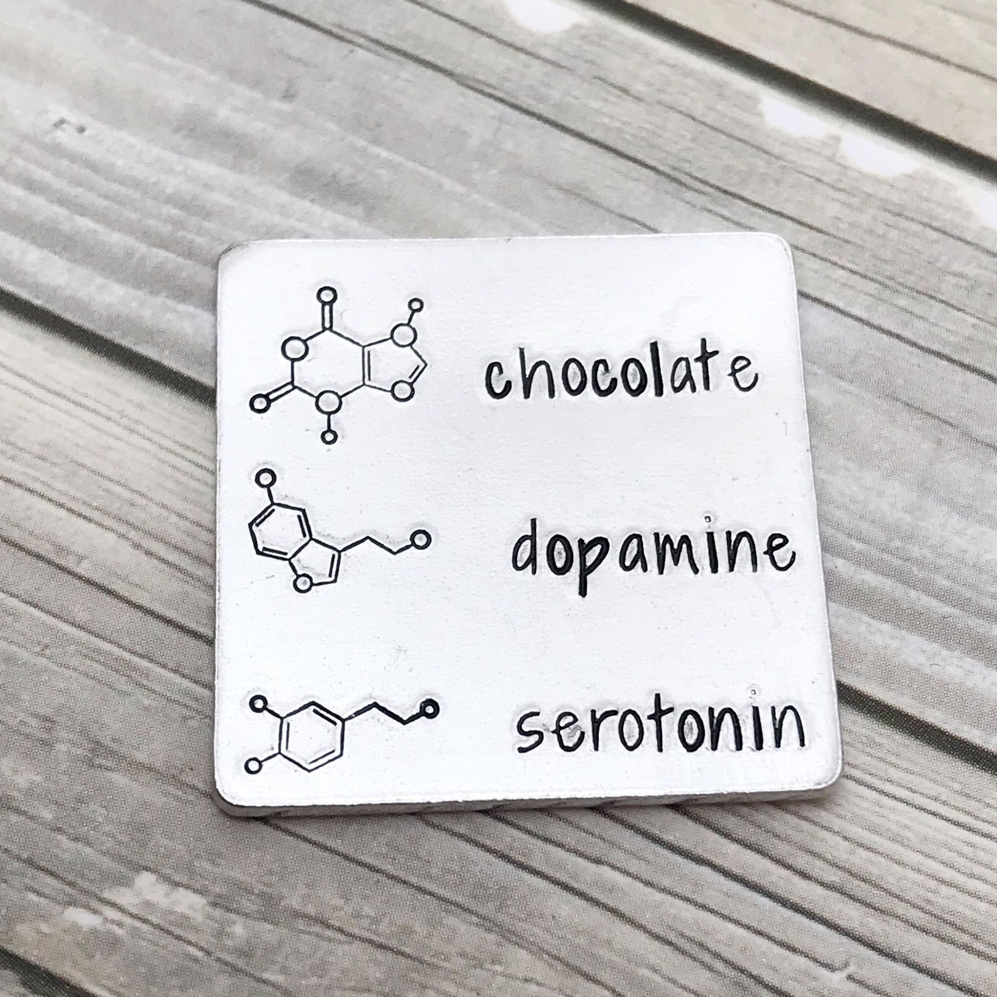Chemical sybols for chocolate, dopamine and serotonin