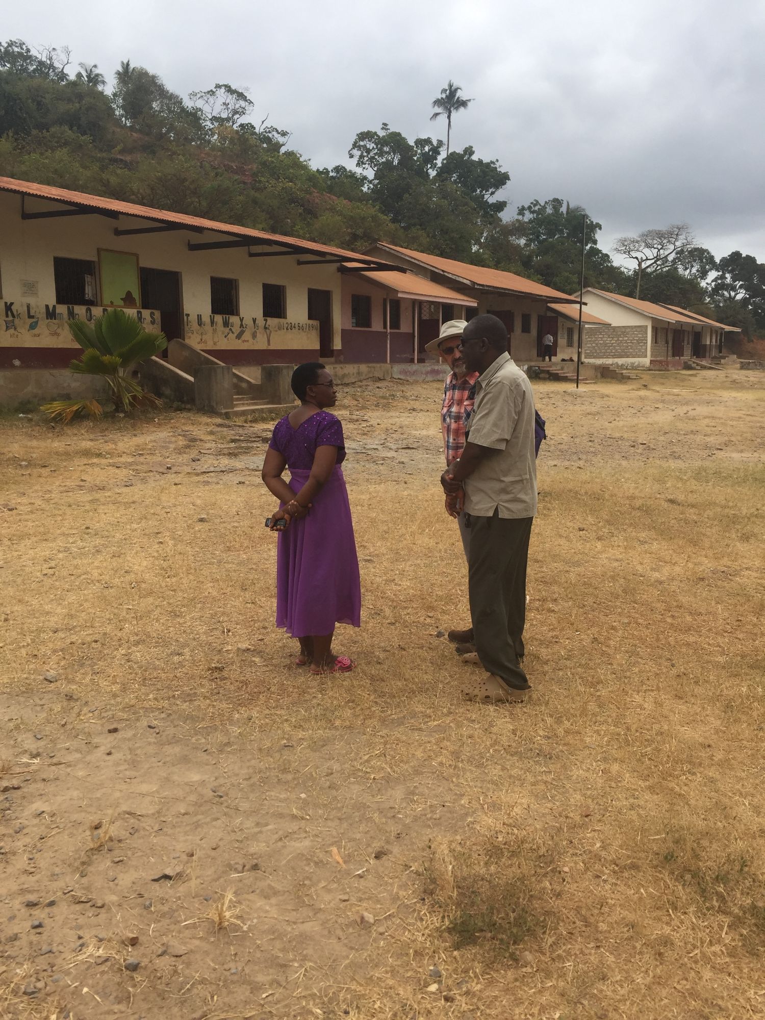 Agnes, head teacher in 2017, talks to Gordon and Rev Charles