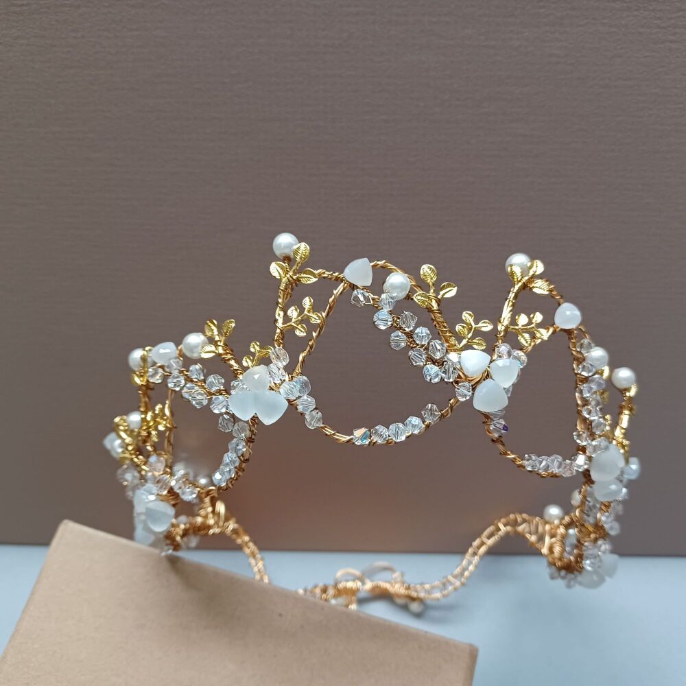 MNLT-An opal white and yellow gold tiara with sparkling crystals