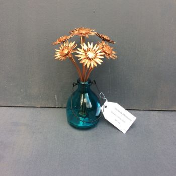 Bunch of copper gerbera daisies arranged in vase
