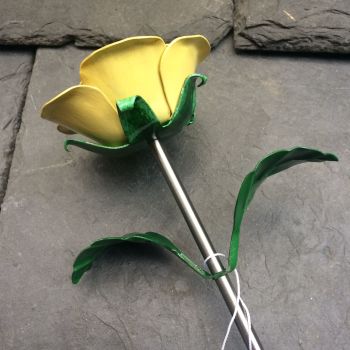 Yellow steel rose, metal rose flower in yellow
