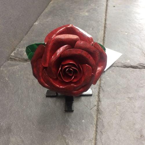 Dark red steel rose with a display stand