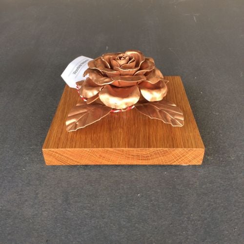 Elegant copper rose sculpture mounted on an oak plaque, wall hanging or fre