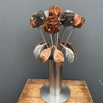 Rose arrangement in a steel vase