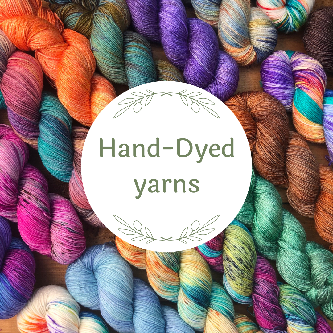 Image shows a range of colourful hand-dyed sock yarns