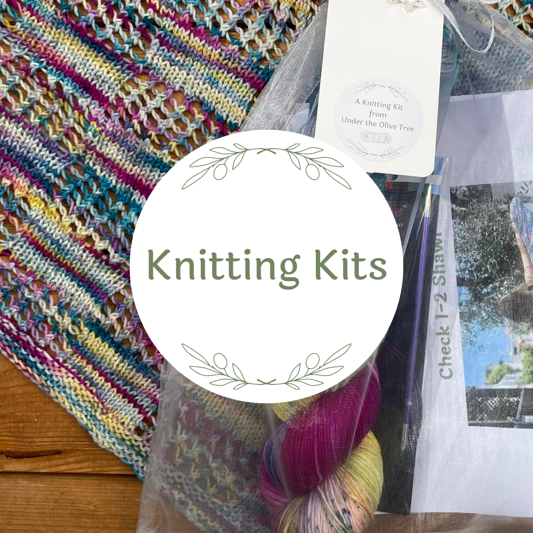 Image shows a knitting kit with hand-dyed yarn and a pattern