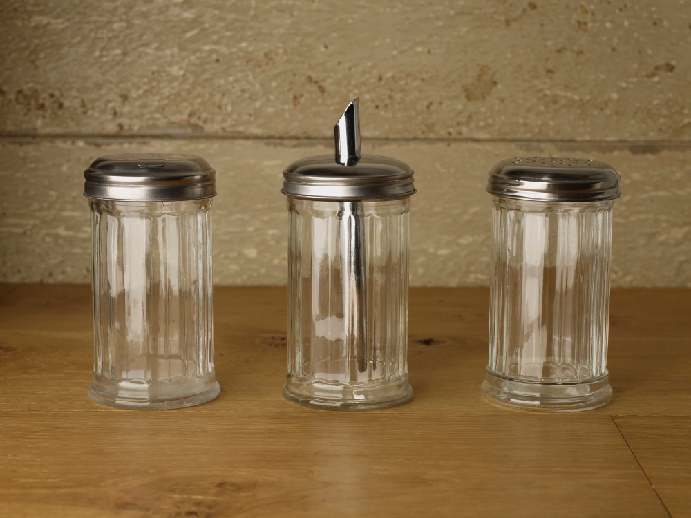 Selection of different kind of glass sugar pourers