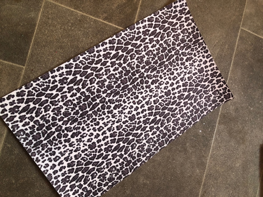 Leopard leatherette small mark to back on edge