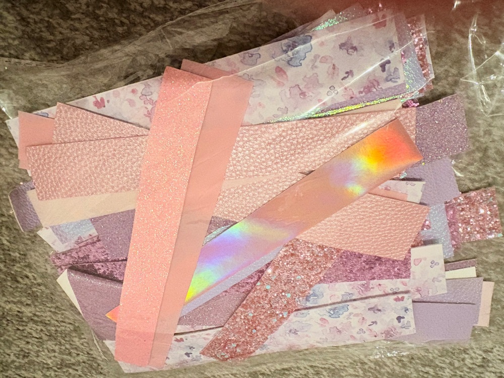 Pink & Lilac off cut strips of leather and glitter fabric