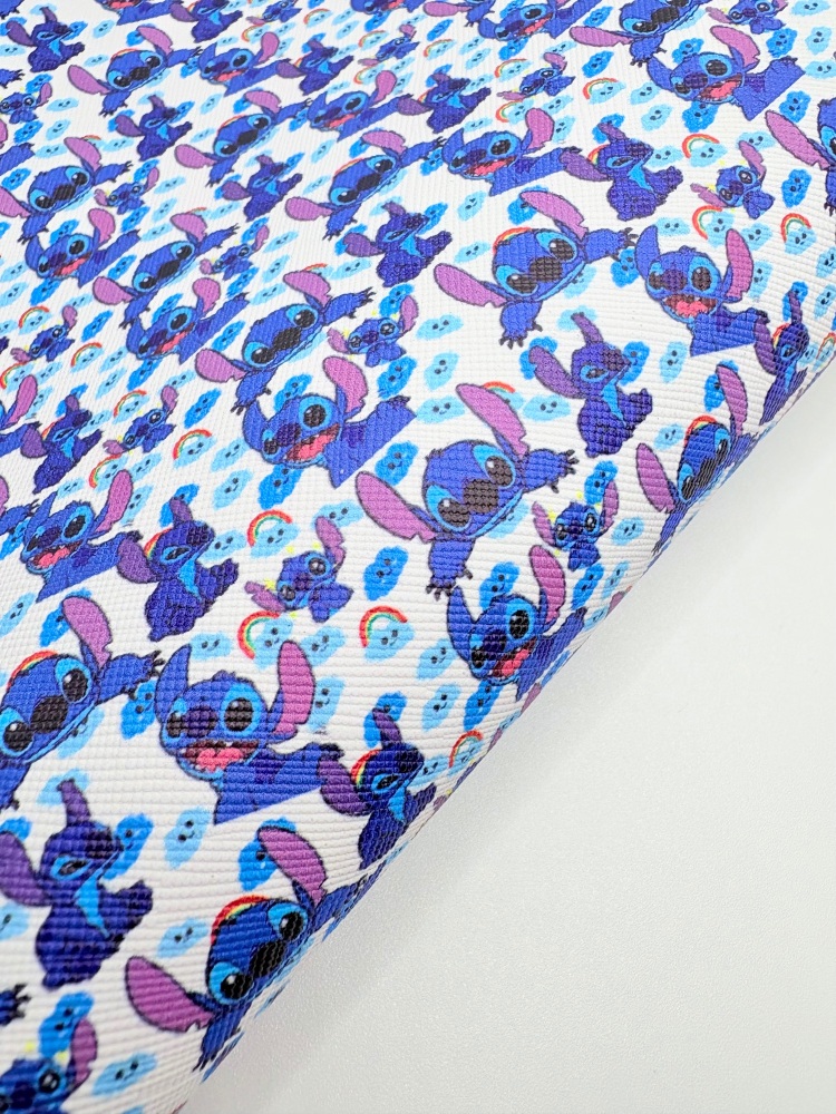 Stitch under the rainbow printed leatherette fabric