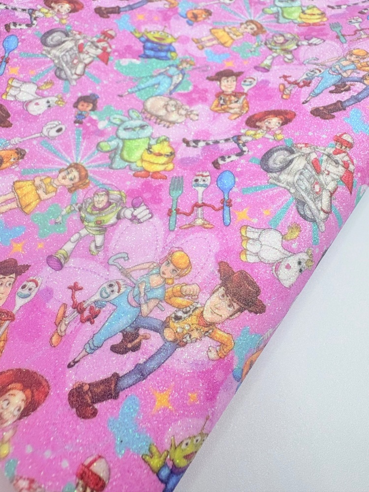 Pink toy story collage printed fine glitter fabric