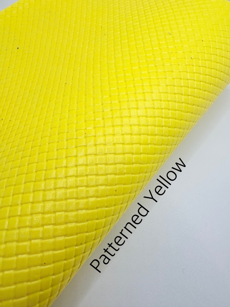 Glossy yellow patterned plain leather