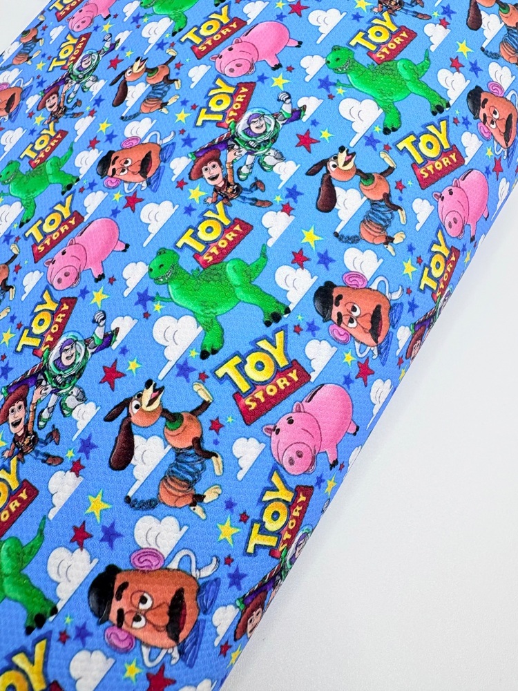 1802 - Blue toy story collage printed canvas fabric sheet
