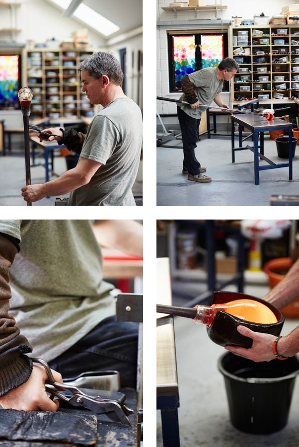 Stewart Hearn cutting the molten glass with shears, shaping the molten hand blown glass. Photo Alun Callender