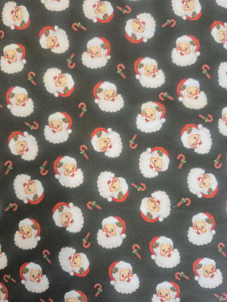 Sew Cool 60" Santa faces on dark green