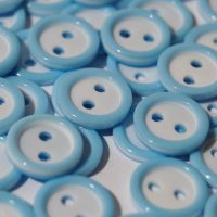 PACK OF 15 2 HOLE 10MM BUTTONS,  IN BABY BLUE AND WHITE.