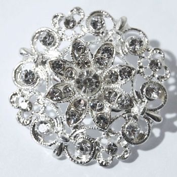 SILVER METAL AND JEWELLED RETRO STYLE BROOCH.