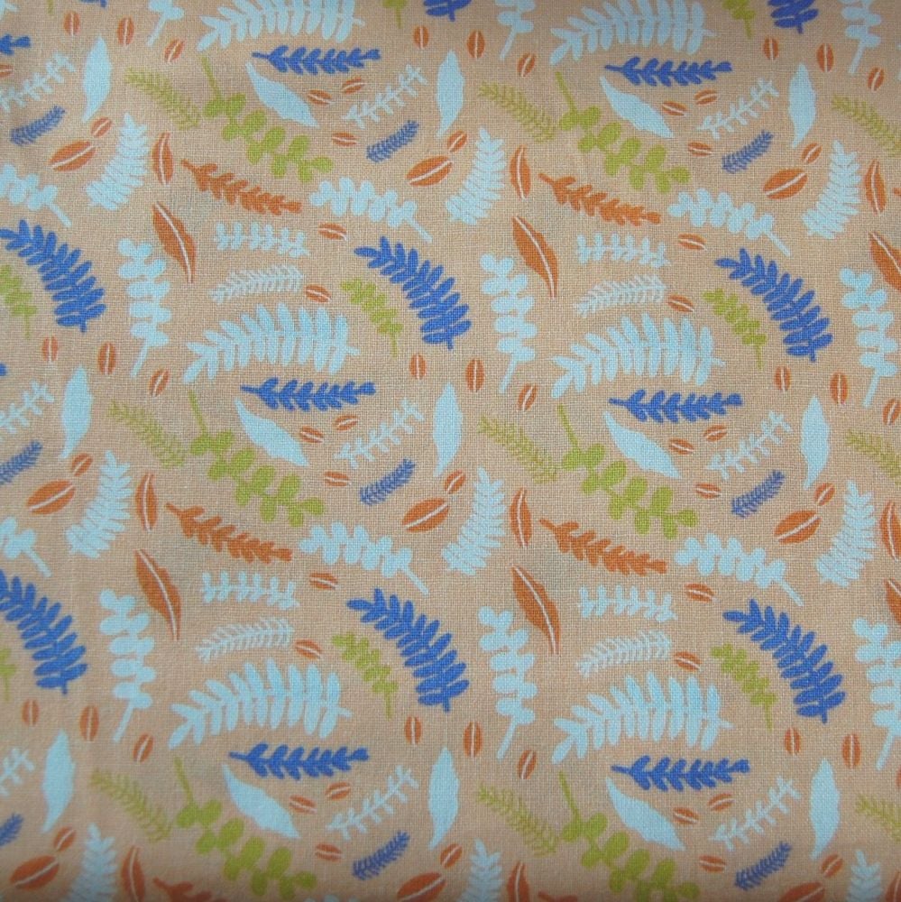 100% COTTON BY THE COTTON CRAFT CO'. FERNS ON A CORAL BACK.