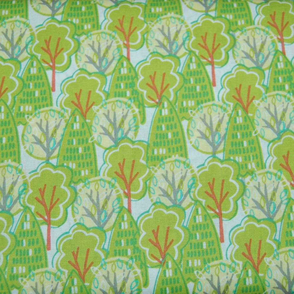 100% COTTON BY THE COTTON CRAFT CO'.  GREEN TREES ON A WHITE BACKGROUND.