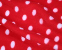 RED AND WHITE POLKA DOT POLAR FLEECE, 58 INCH WIDE.