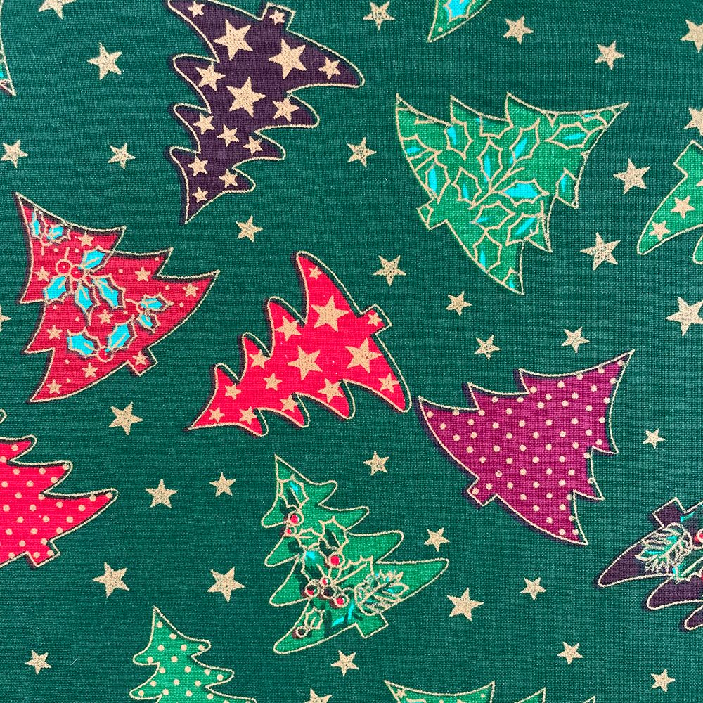 CHRISTMAS TREES ON GREEN, 140 CMS WIDE, 100% COTTON. MED WEIGHT.