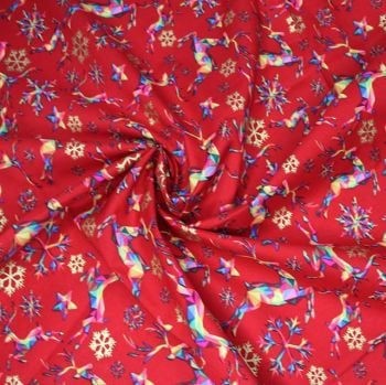 METALLIC RANGE BY LITTLE JOHNNY, 100% COTTON. LEAPING REINDEER ON A RED BACK. 53 INCH WIDE