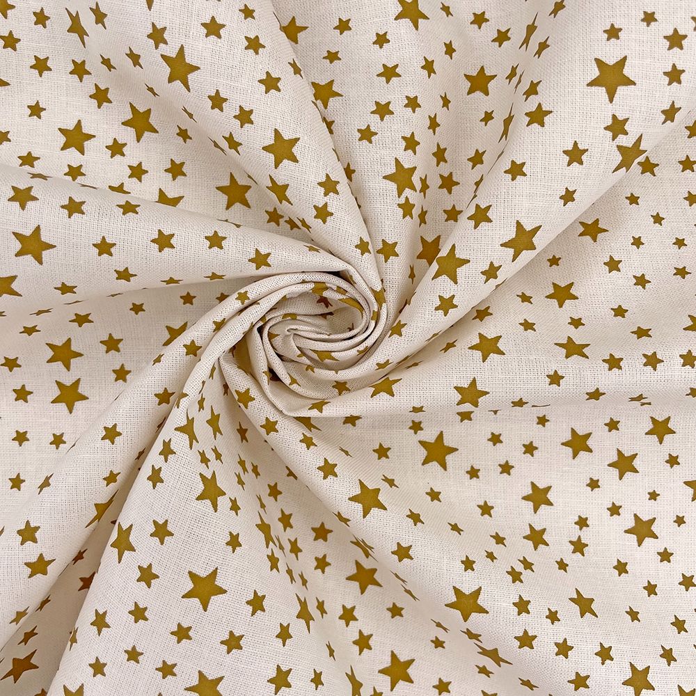 Metallic gold stars on cream, 140cms wide, 100% cotton, med weight from Cha