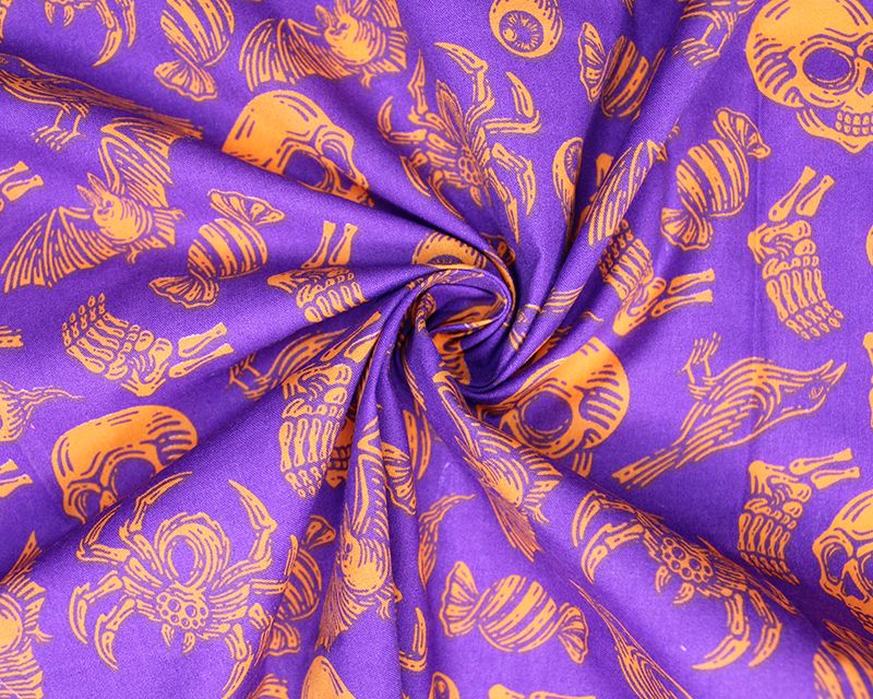 80% Cotton, 20% poly skulls and spiders on purple.